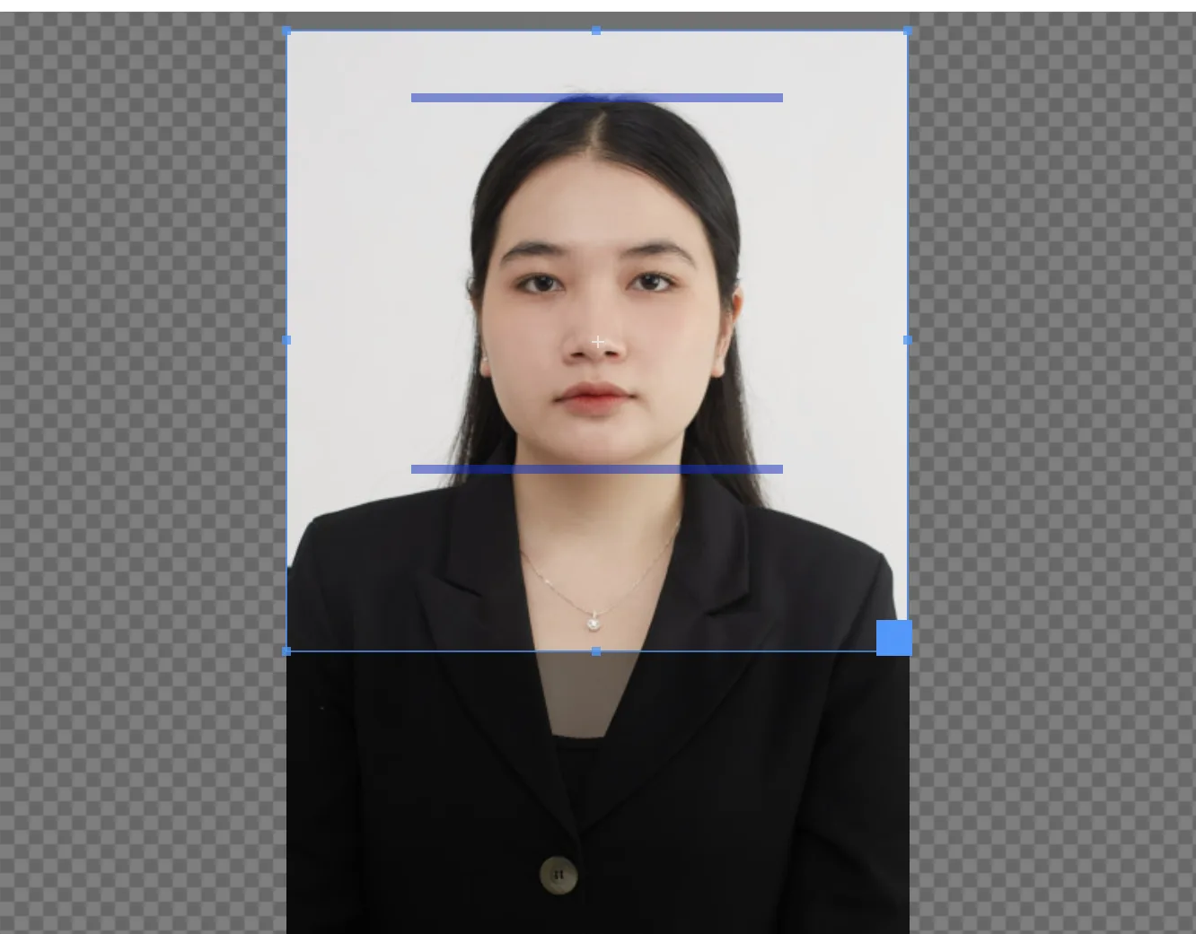 123PassportPhoto crop box with crown and chin bars placed over a woman's portrait